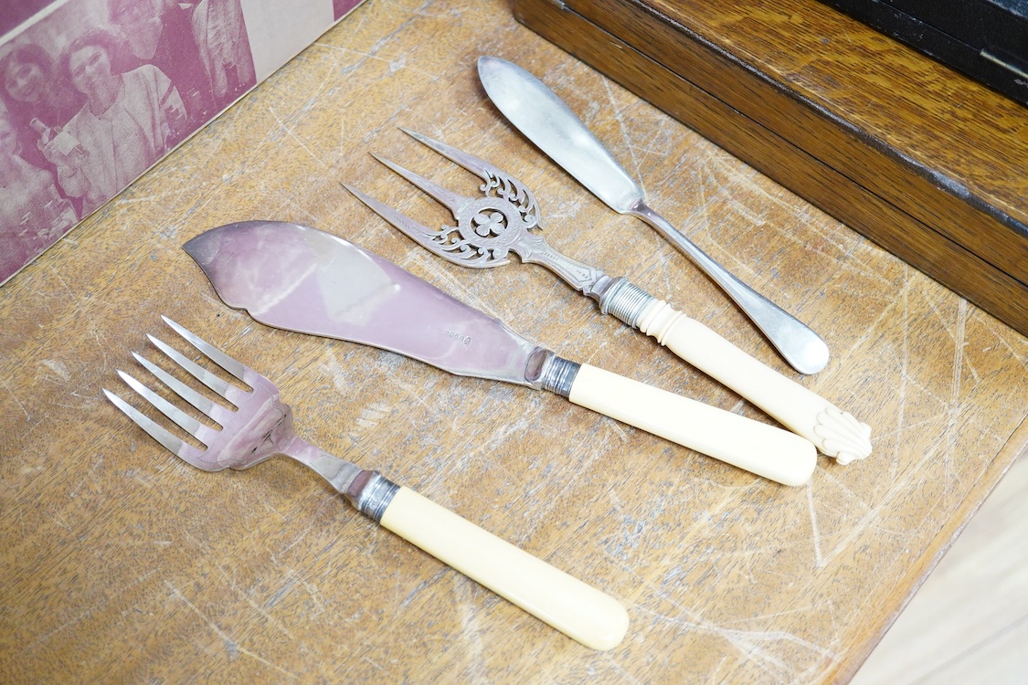 A quantity of assorted plated items including entrée dishes, flatware and mugs.